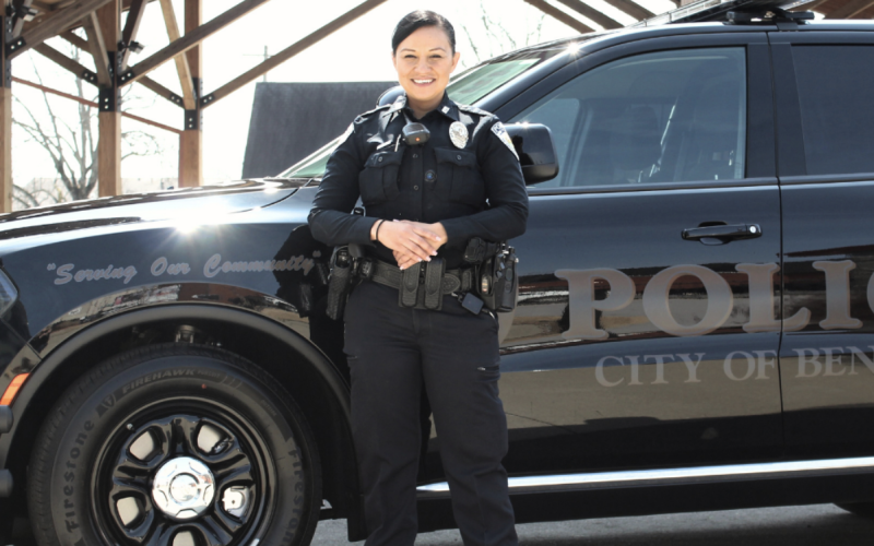 Police officer next to suv