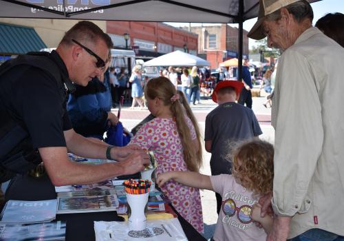 community outreach officer with family